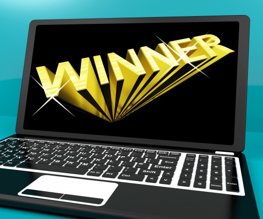 Winner Word On Computer Representing Success And Victory